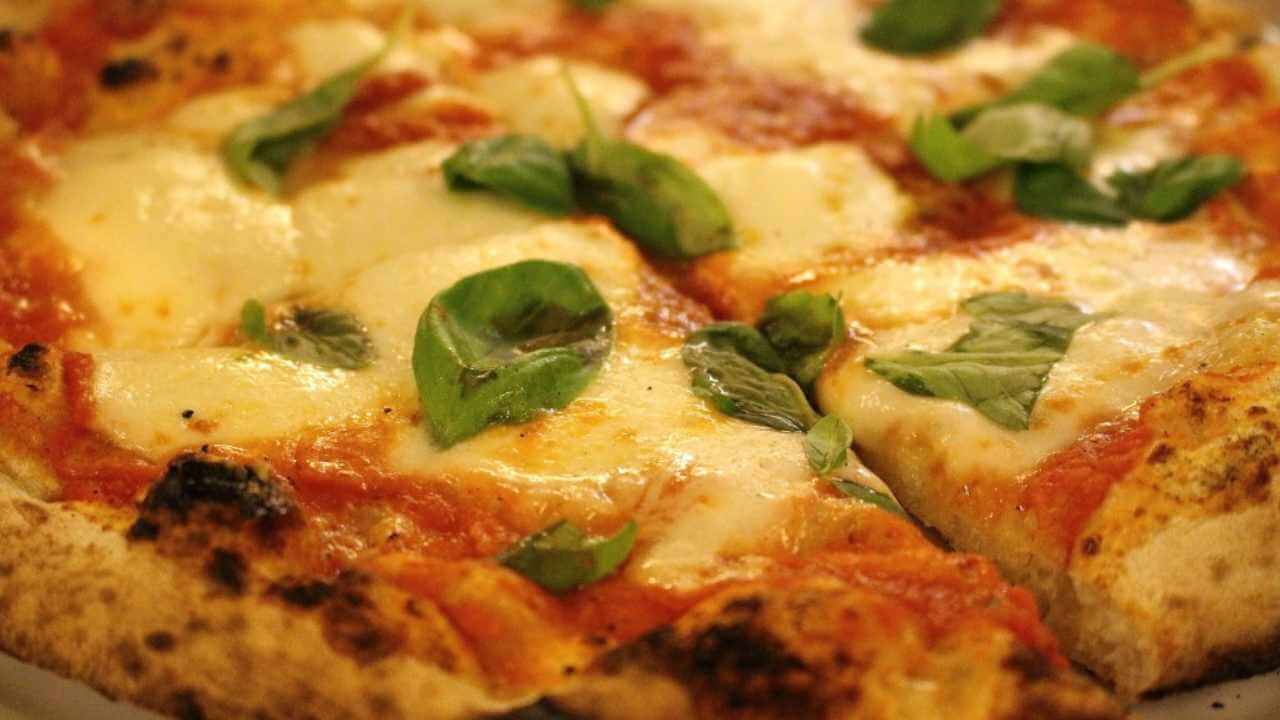 a close up of a pizza on a plate 