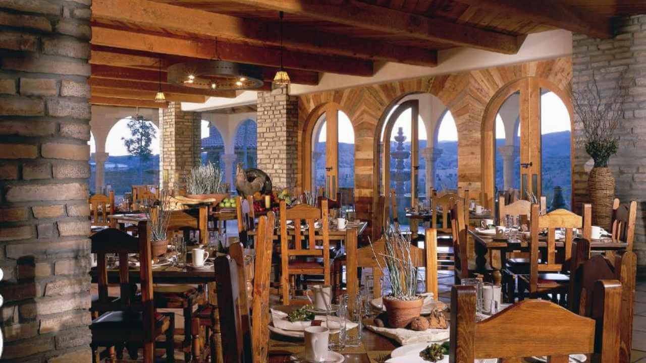 restaurant inside lajitas golf resort with views of golf course