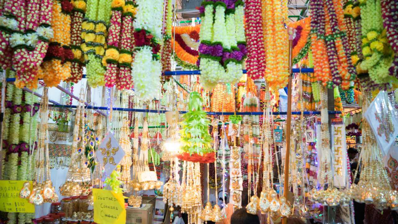 Colorful garlands hanging from the ceiling in a market