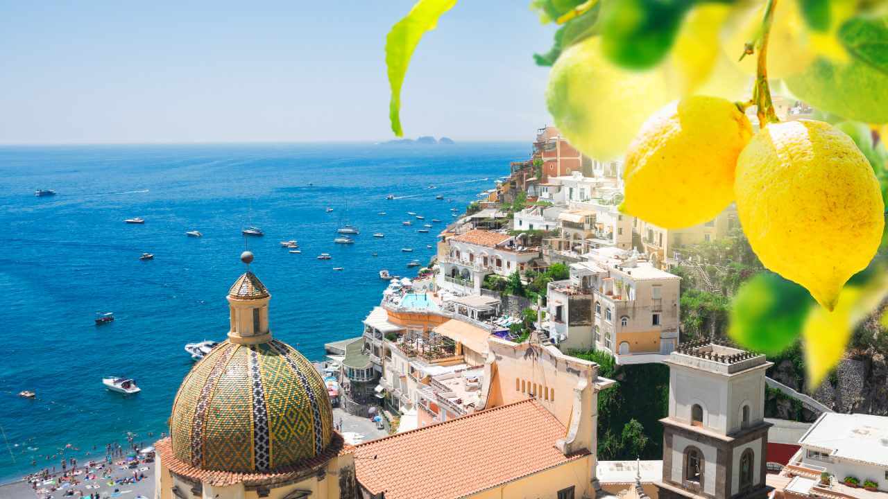 view of buildings in sorrento with lemons in the top right corner, sorrento is known for limonchello