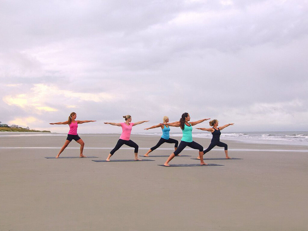 Enjoy an early morning yoga class on the beach.