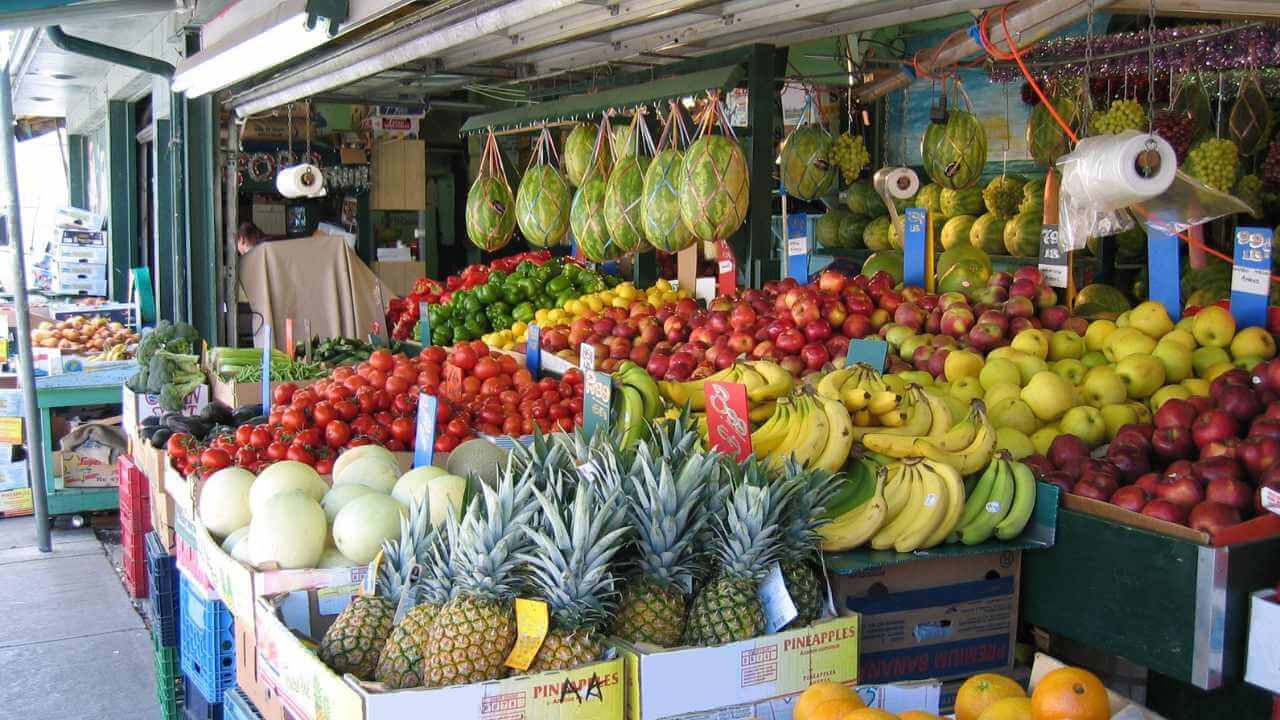 a fruit stand with many different types of fruit