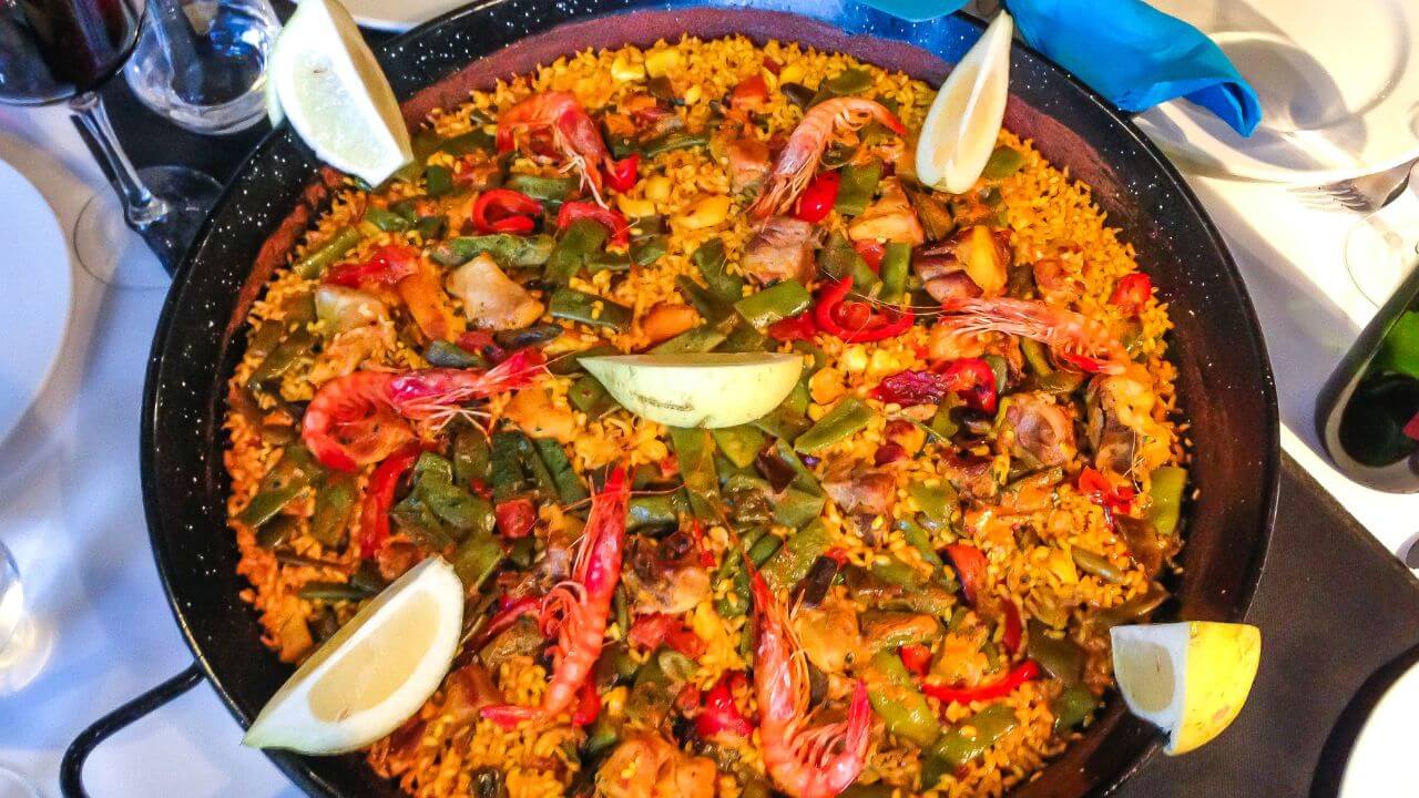 a large paella in a pan on top of a table