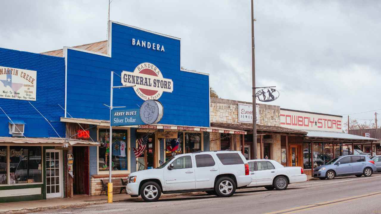 a blue building with cars parked in front of it