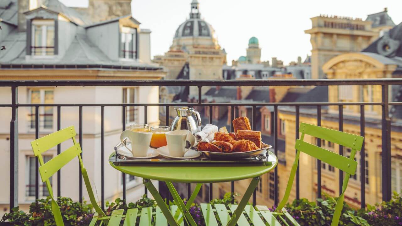 breakfast on the balcony of a hotel in paris