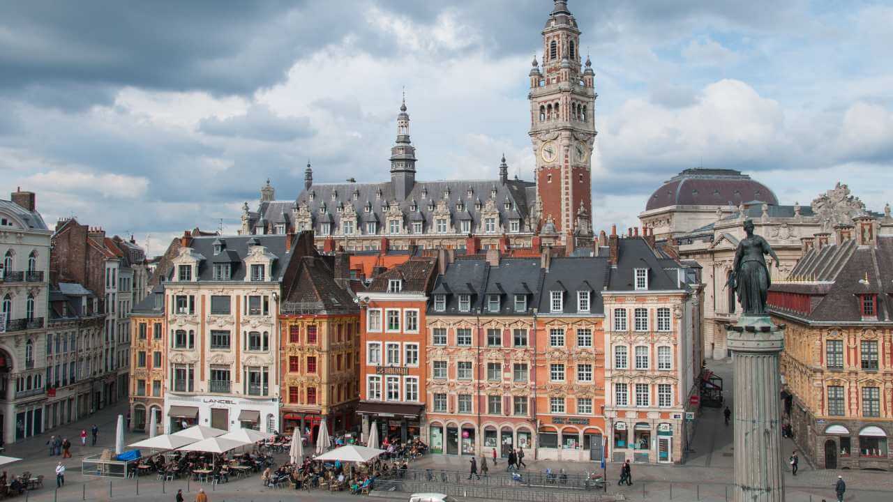 place du general du gaulle, historic city center with clock tower, buildings, goddess statue, lille