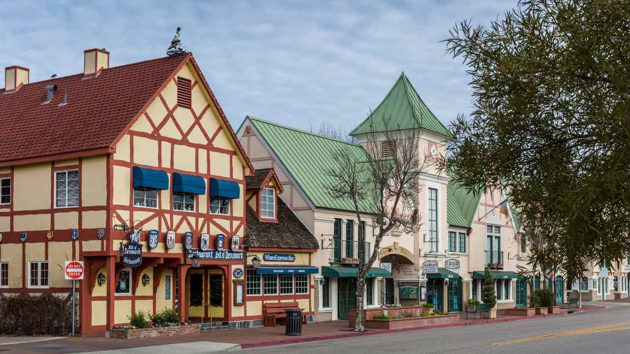 a row of buildings along a street in a small town