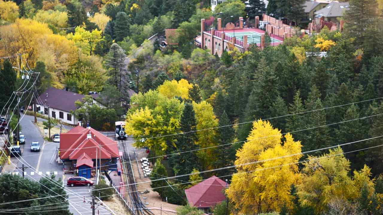 an aerial view of a small town in the fall