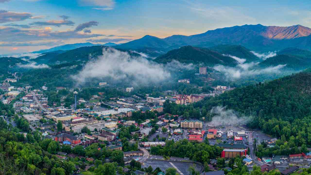 an aerial view of a small town in the mountains