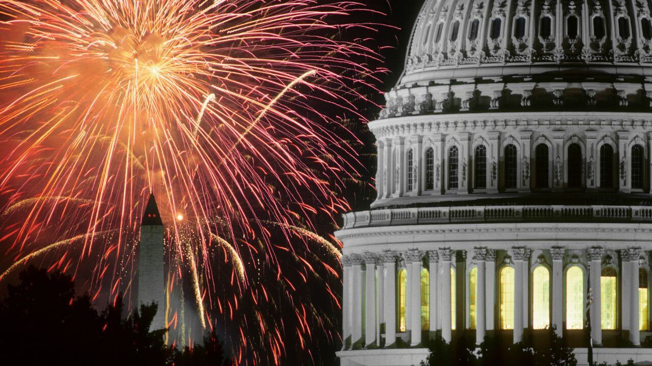 fireworks explode over the capitol building in washington dc