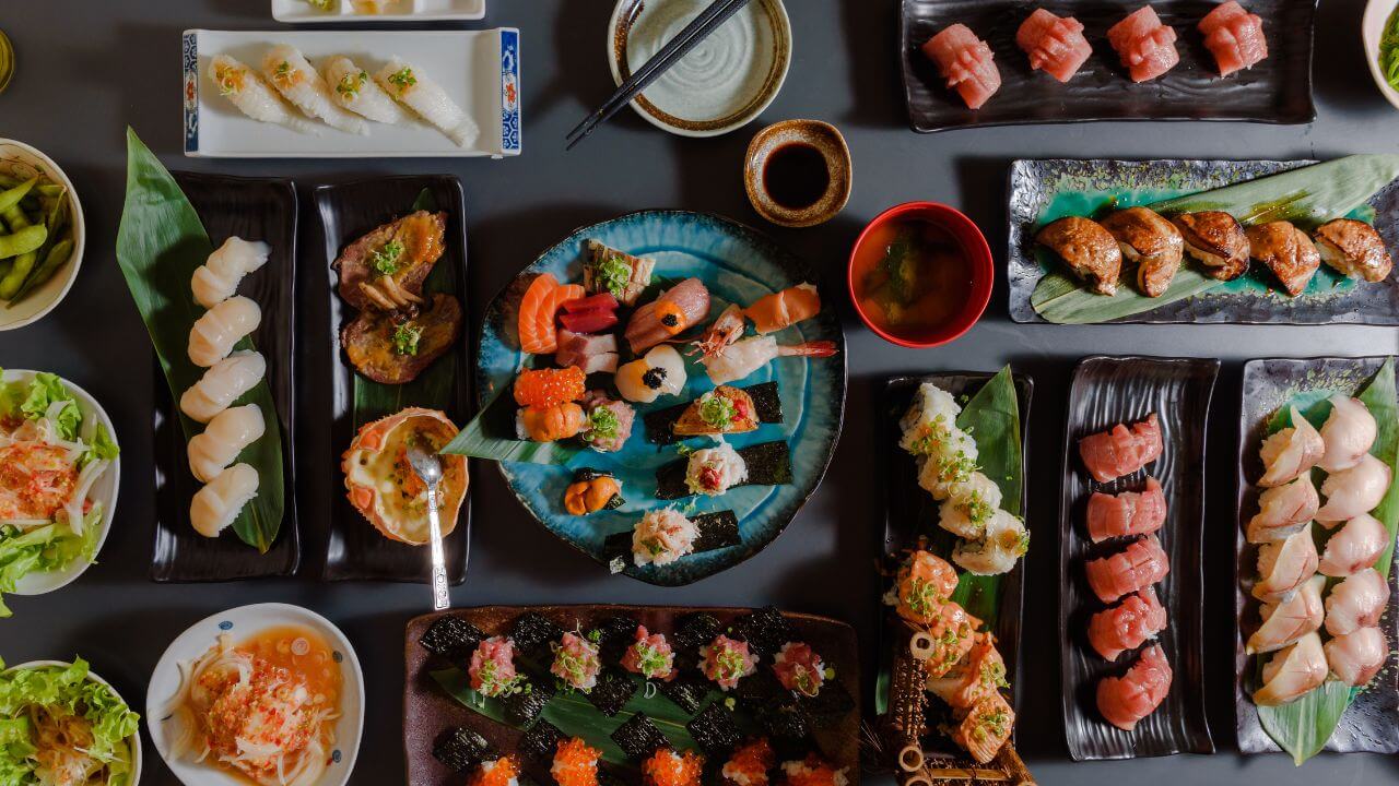 various types of sushi are arranged on a table