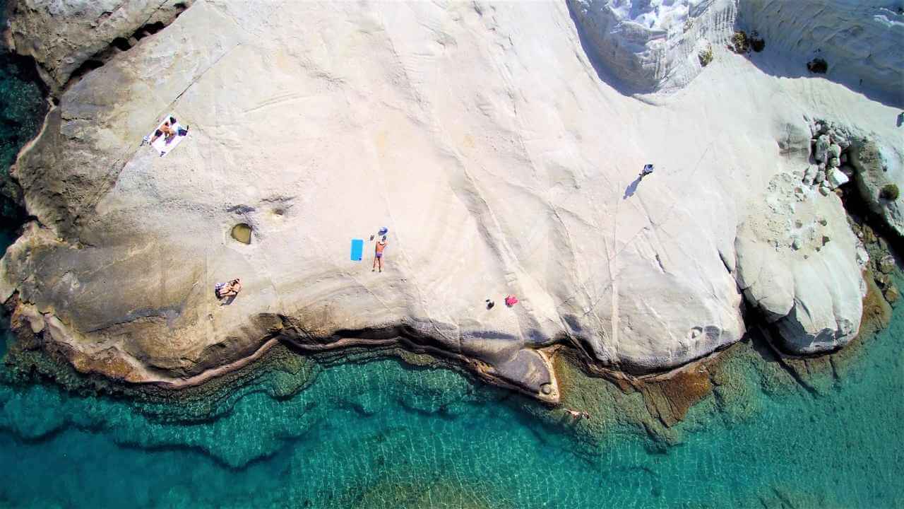 an aerial view of people on the beach
