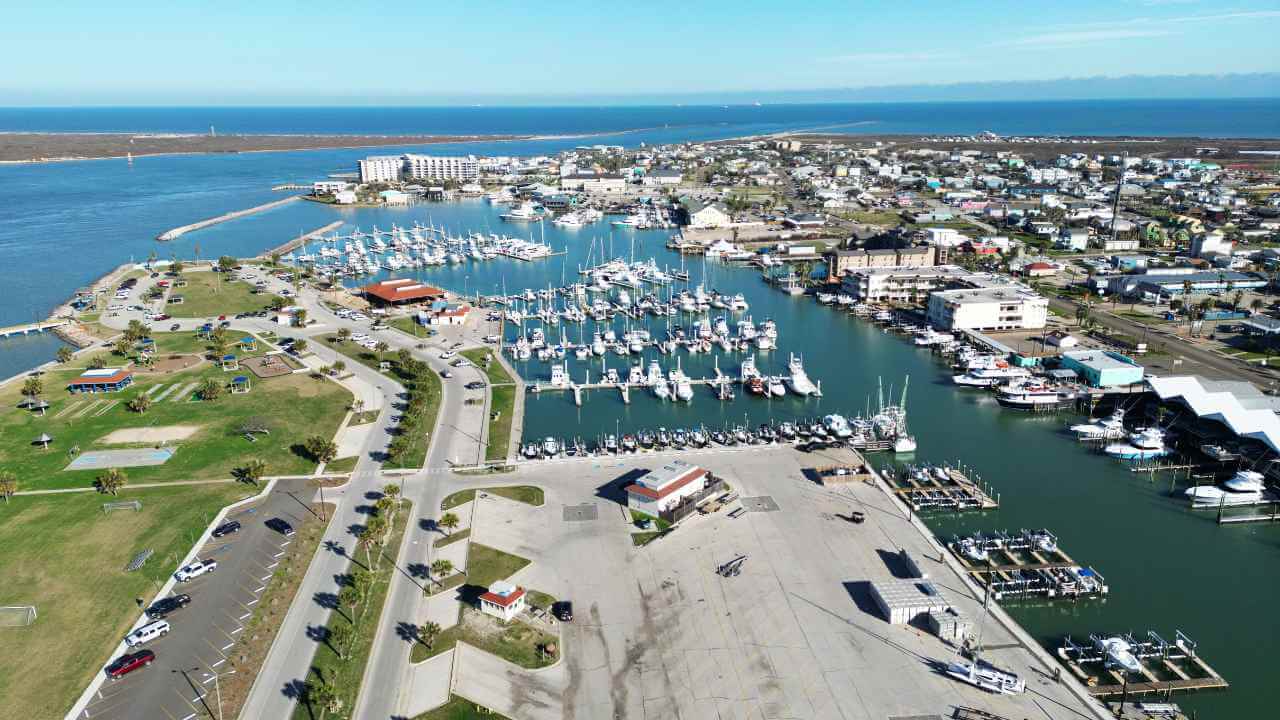 an aerial view of a marina with lots of boats