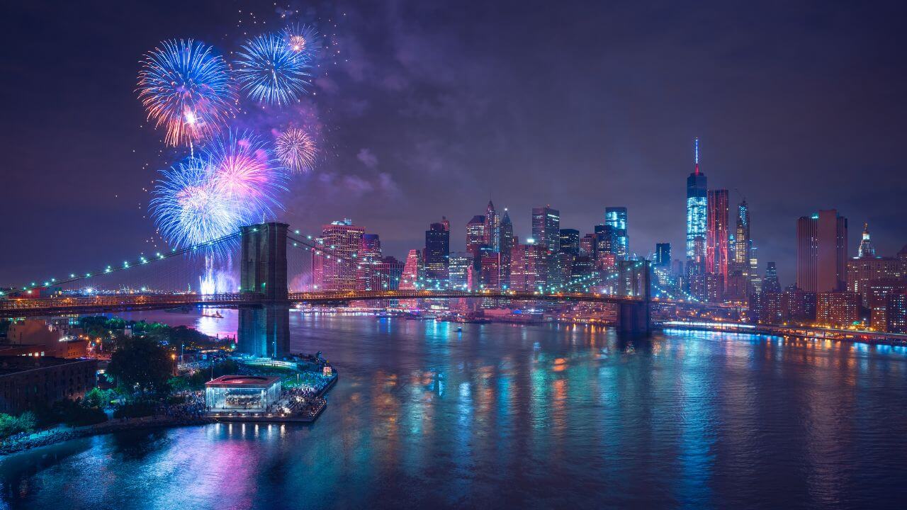 the new york city skyline is lit up with fireworks at night