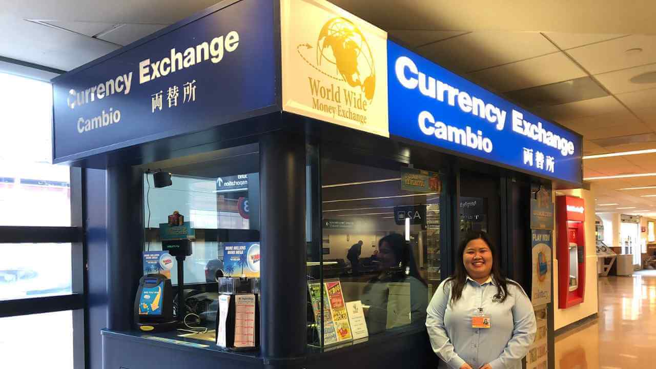 A person standing in front of a currency exchange