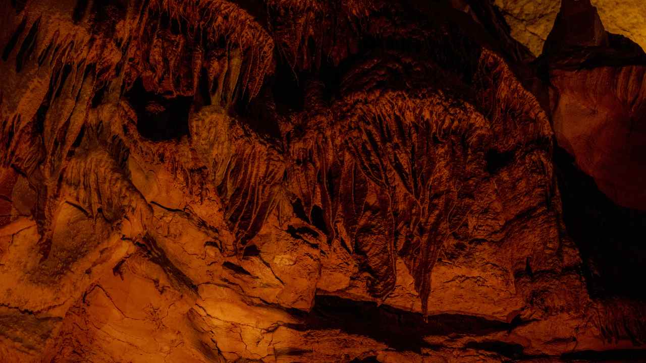 an image of the inside of a cave at night