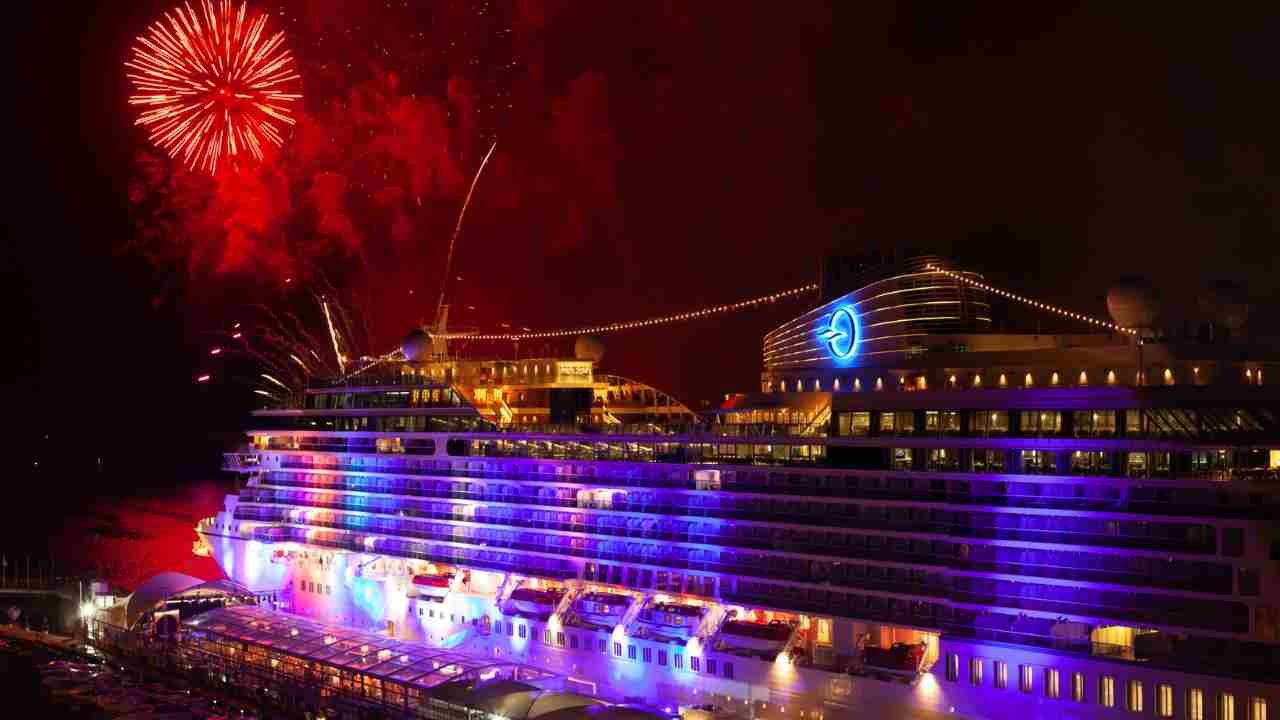 fireworks light up the sky above a cruise ship