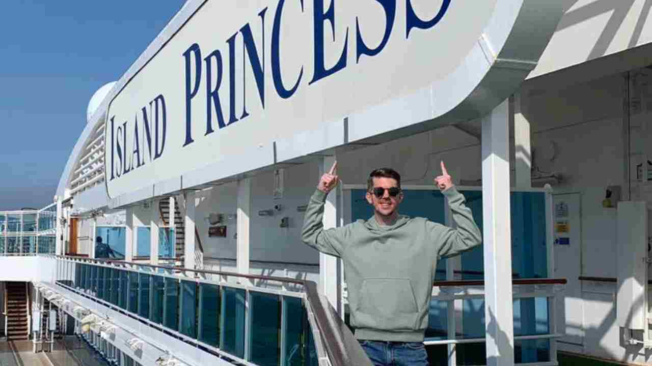 a person standing in front of a sign that says island princess