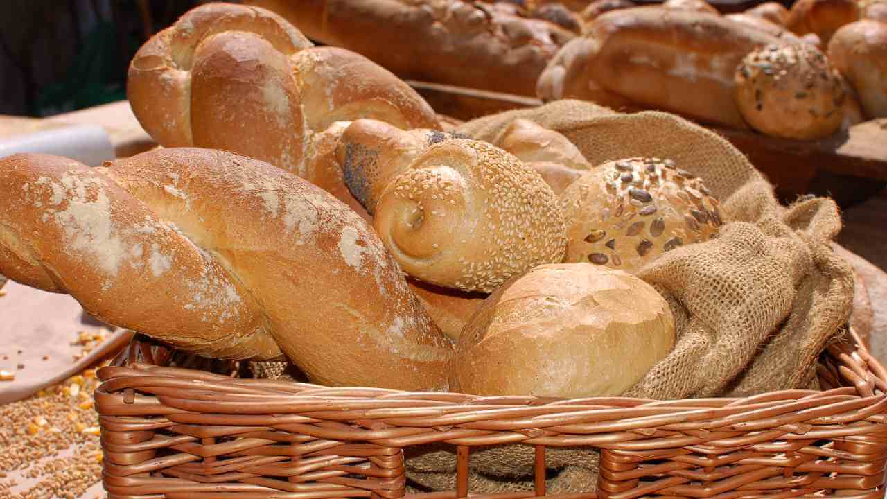 a basket full of breads on display at a market