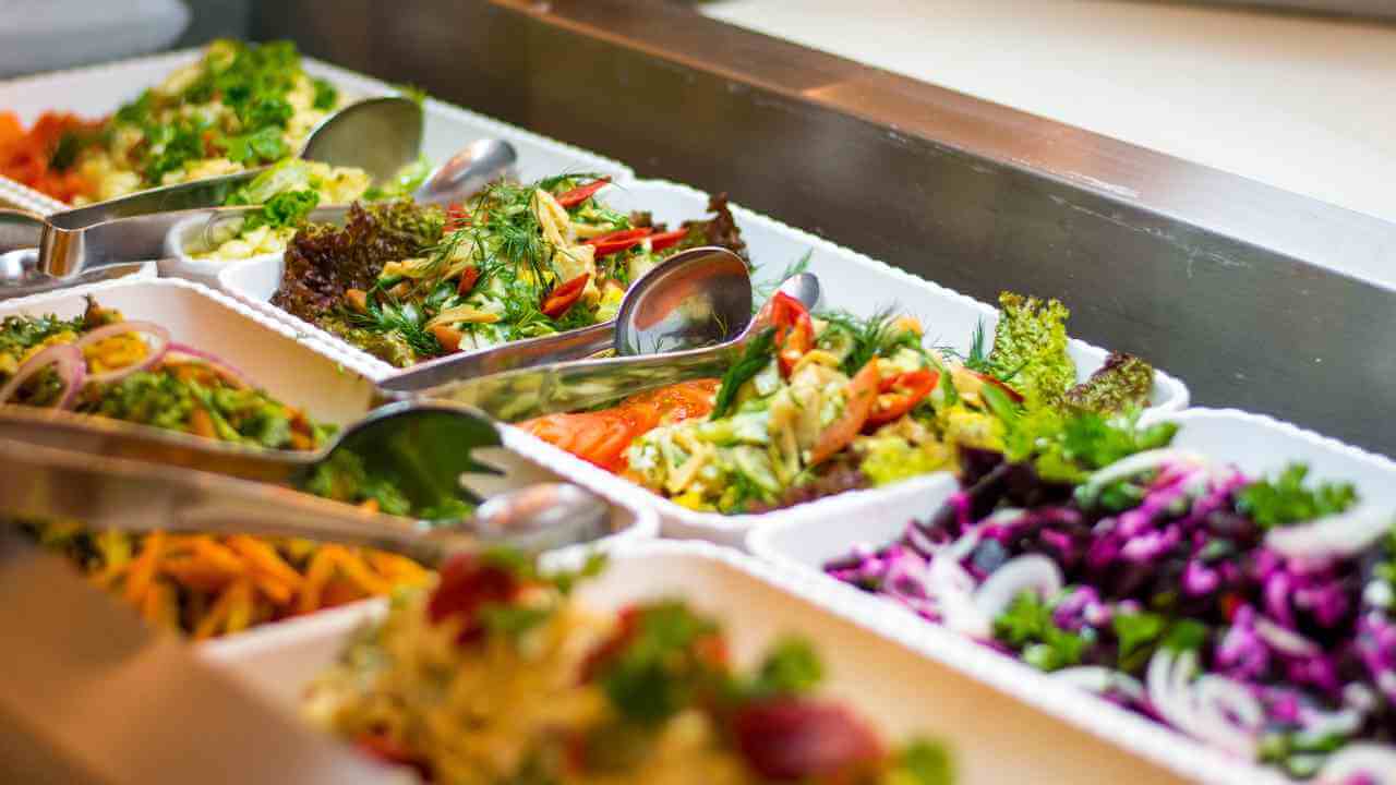 a salad bar with many different types of food in it