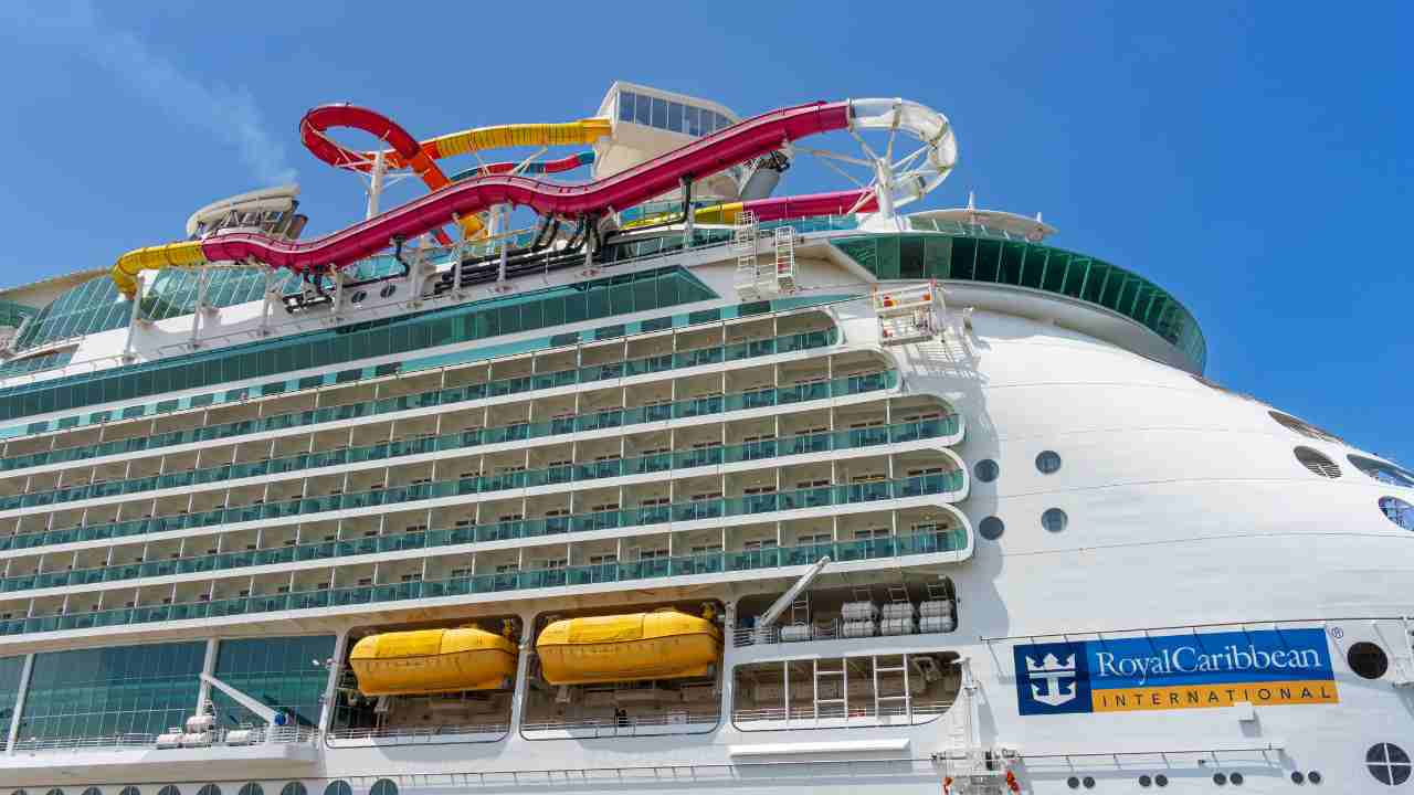 a large cruise ship with colorful water slides