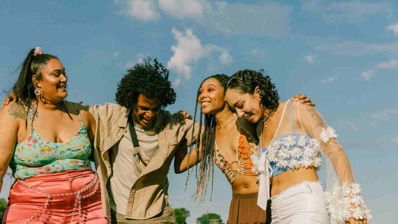 a group of people standing together in a field