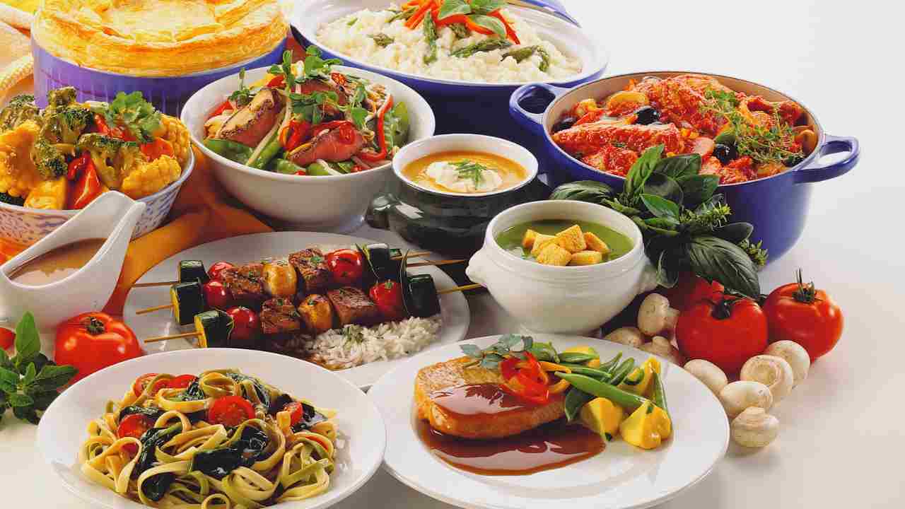 various types of food are arranged on a table