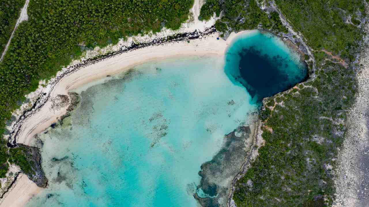 aerial view of turquoise lagoon in bahamas - lagoon stock videos & royalty-free footage