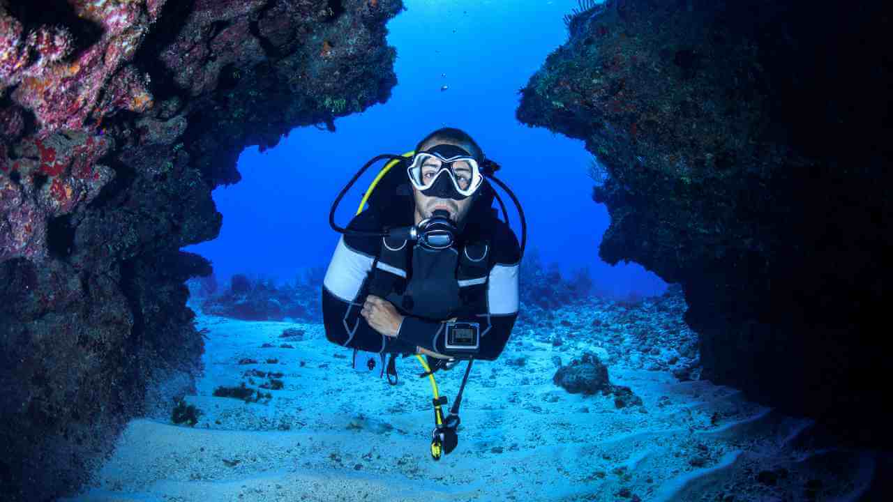 a scuba diver in an underwater cave