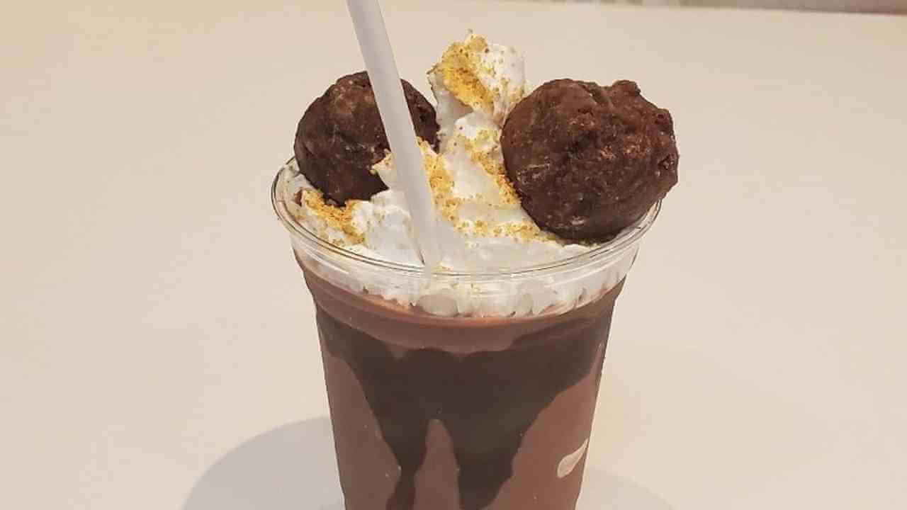 a chocolate milkshake with ice cream and marshmallows