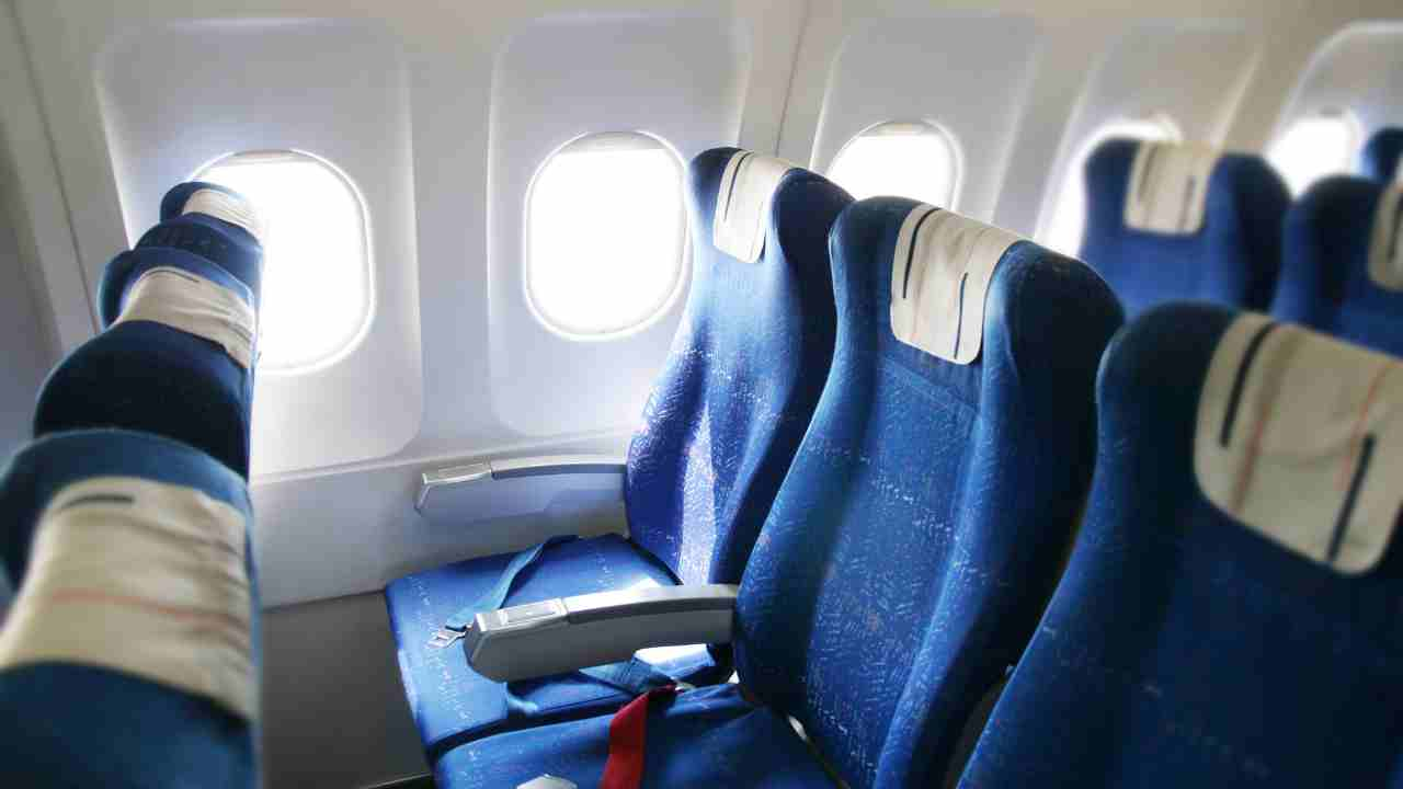 rows of empty seats on an airplane