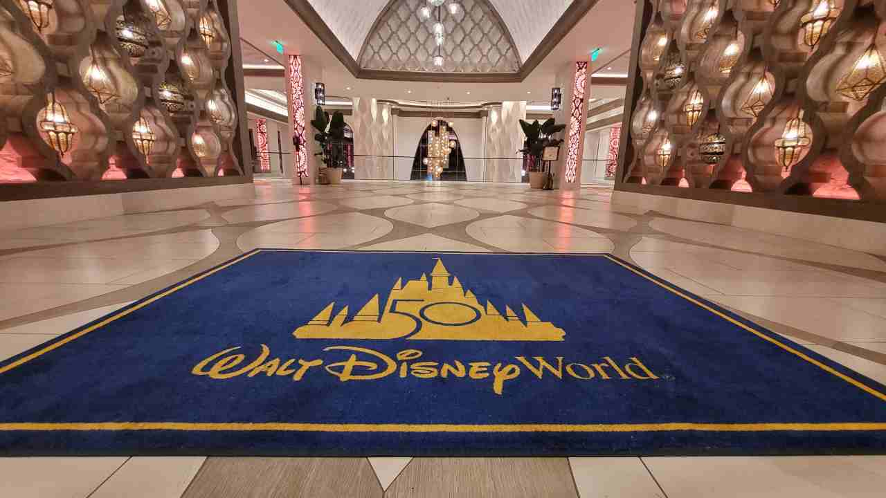 the entrance to the disney world hotel is shown in this photo