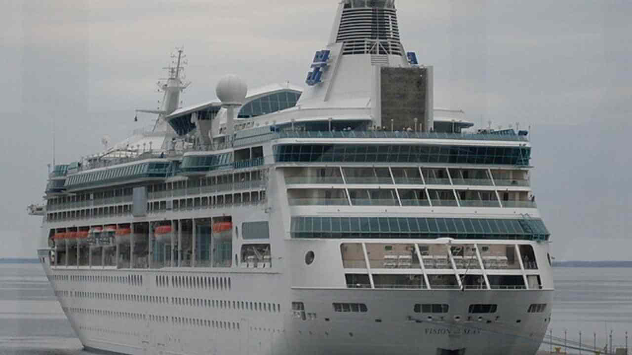 a large cruise ship docked at the dock