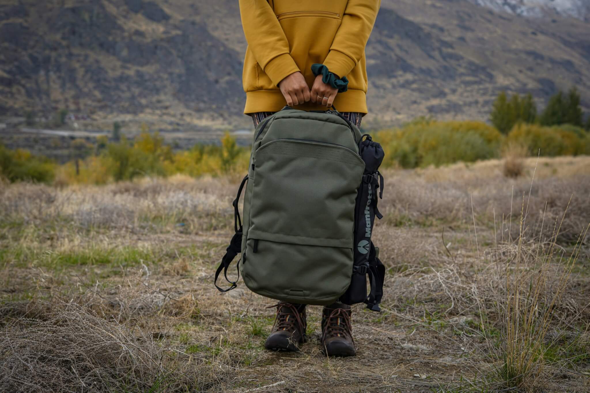 woman holding a backpack