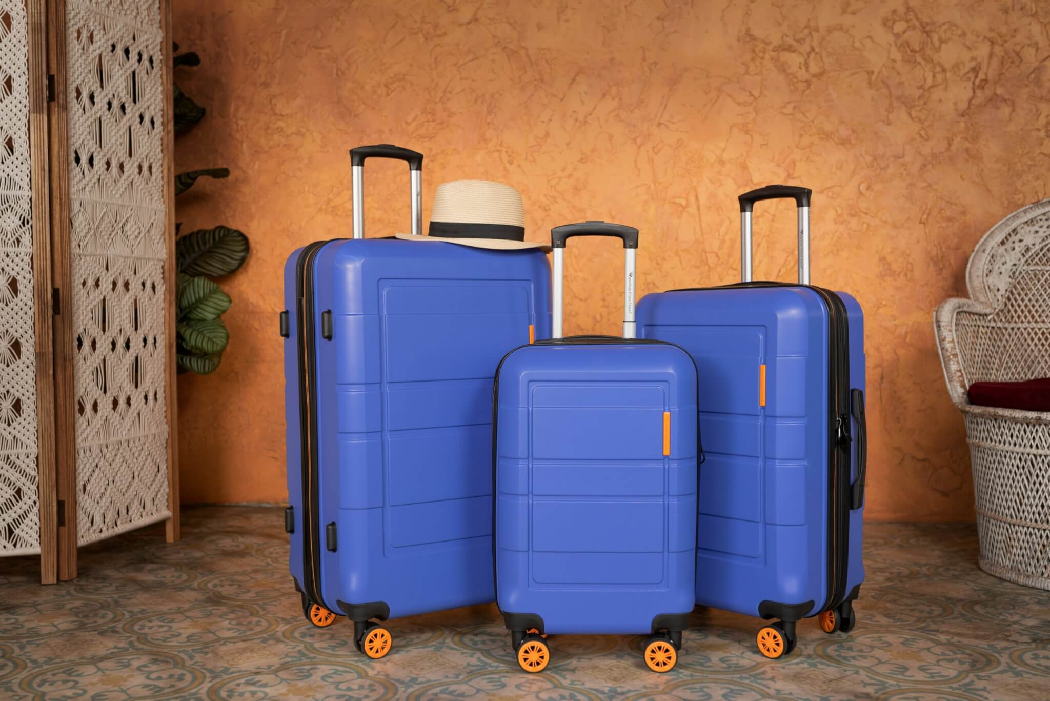set of blue rolling suitcases