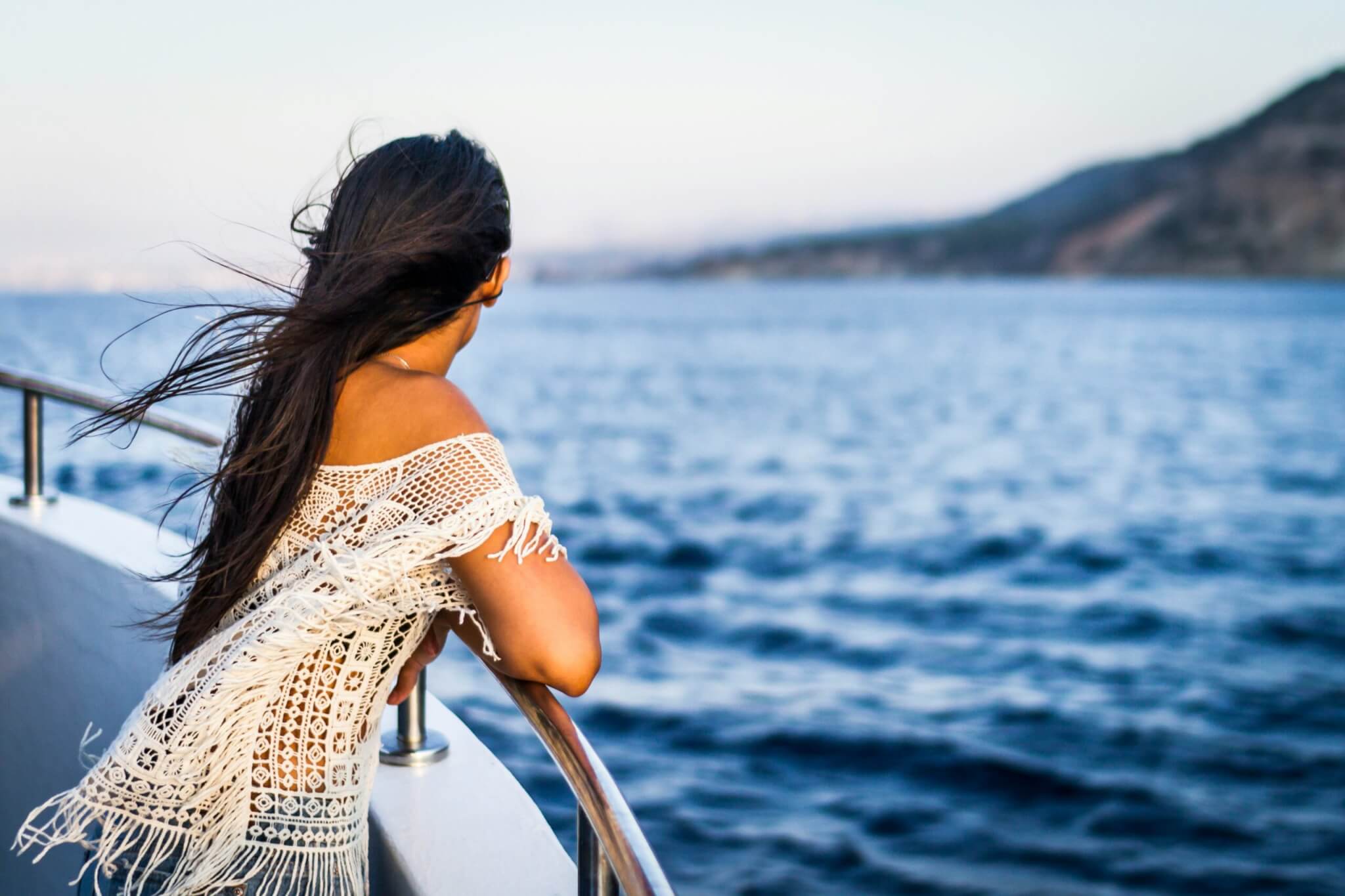 woman standing on a cruise ship