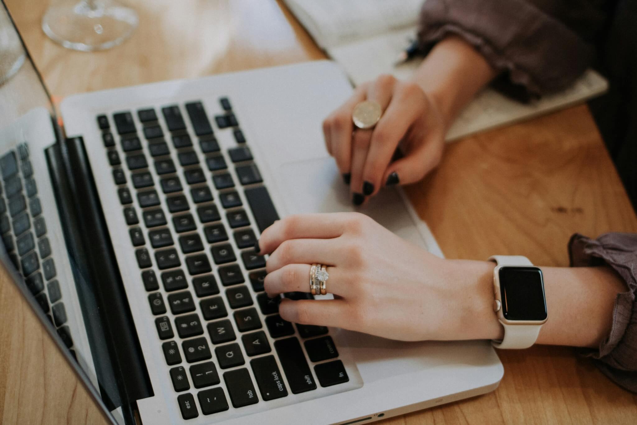 woman typing on laptop