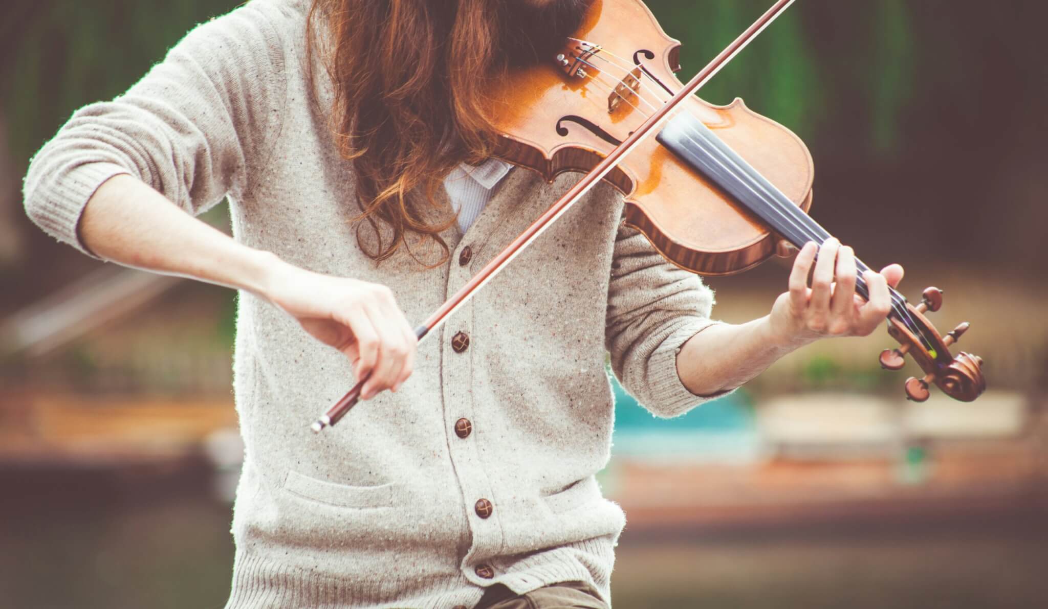 woman playing a fiddle