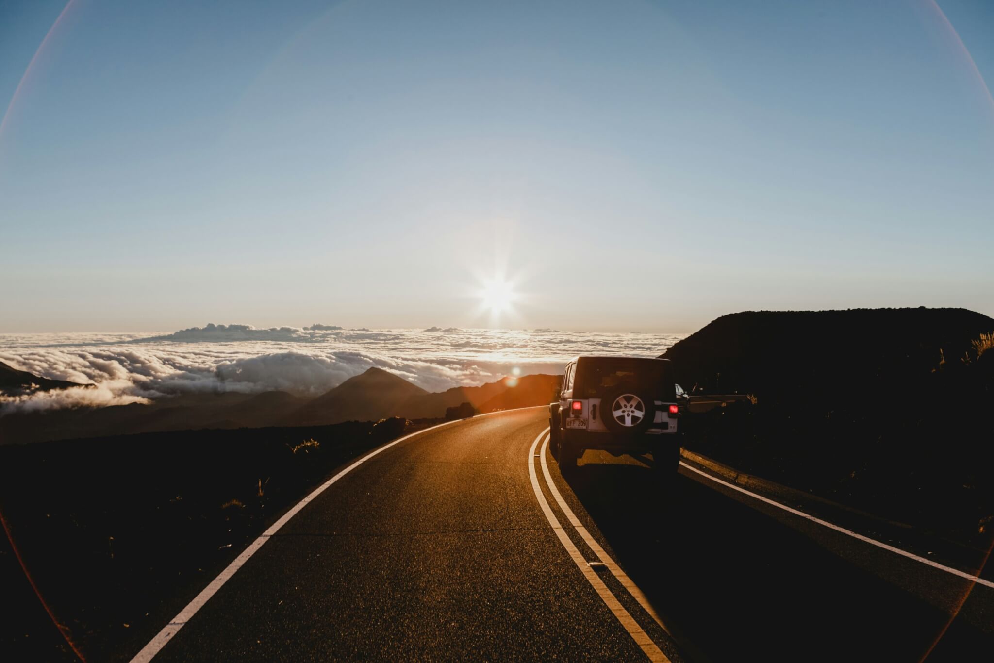 jeep traveling down the road