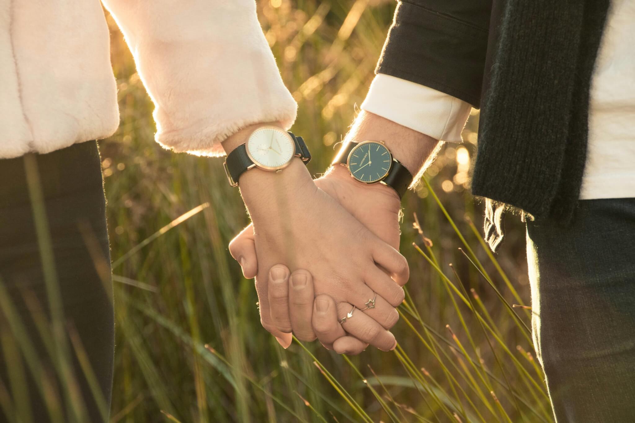 man and a woman with watches