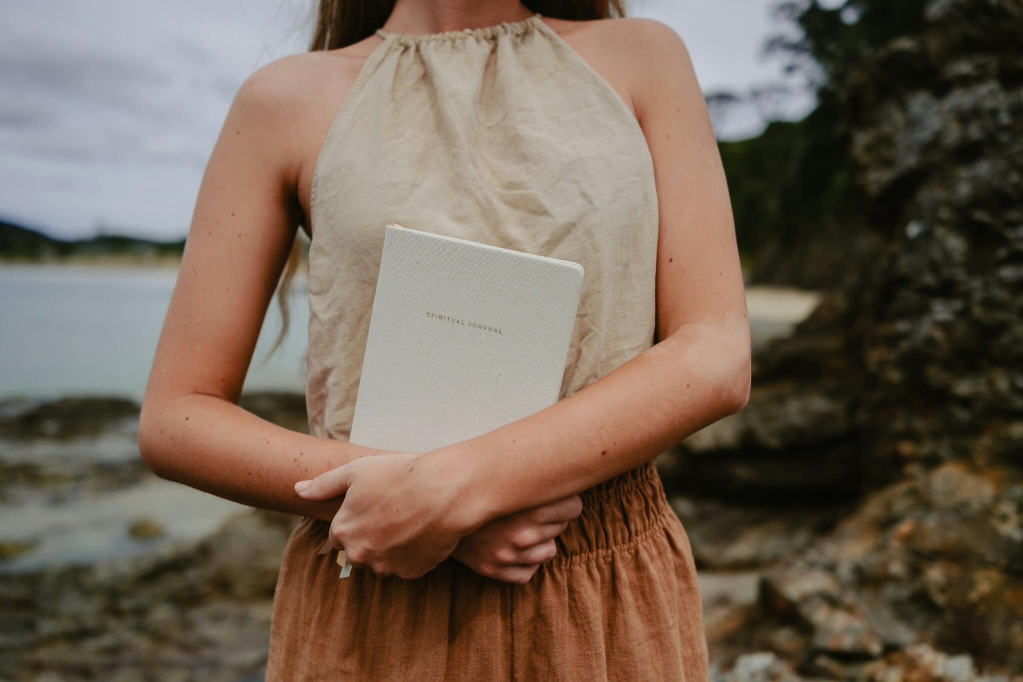 girl holding a journal