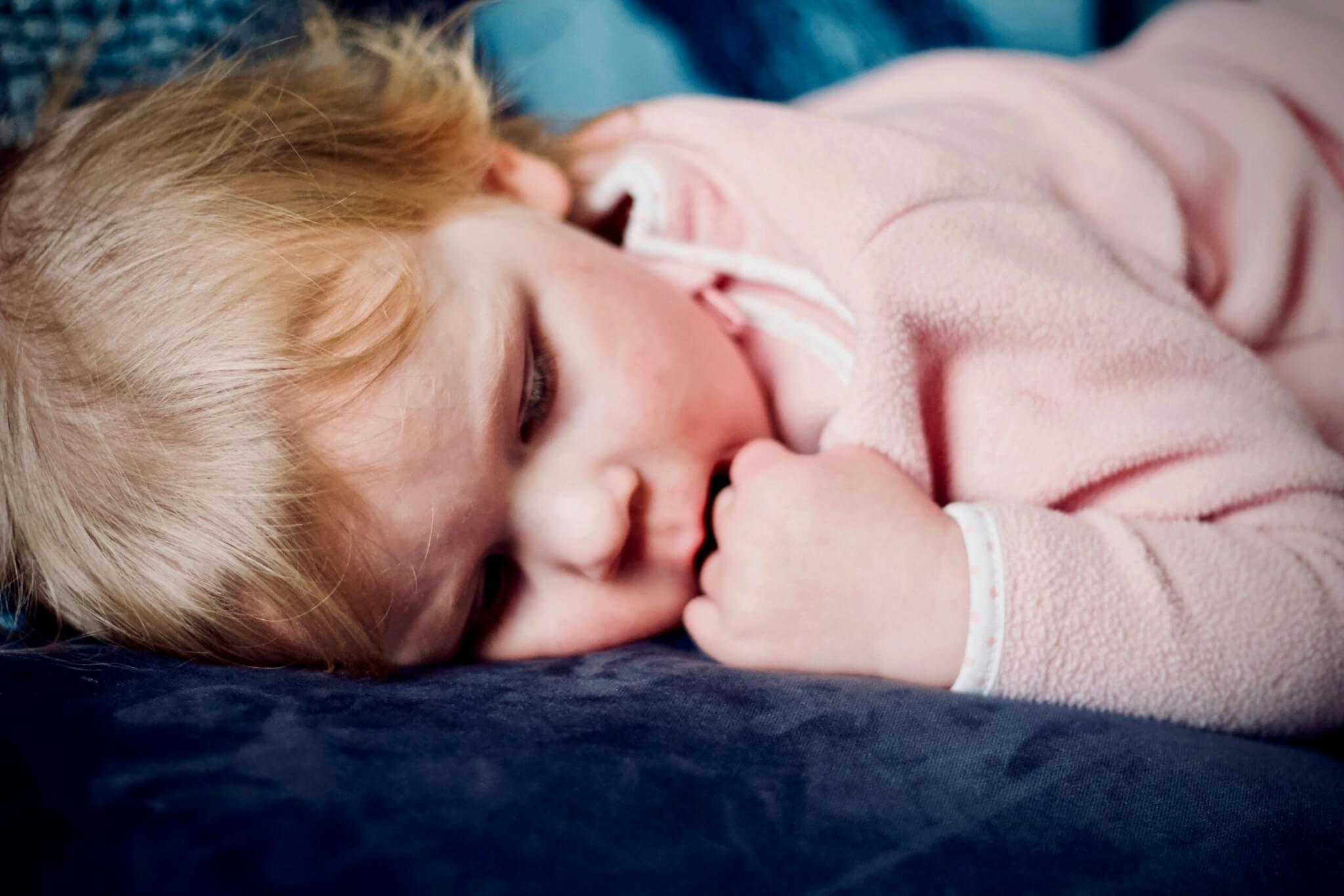 baby lying on a blanket