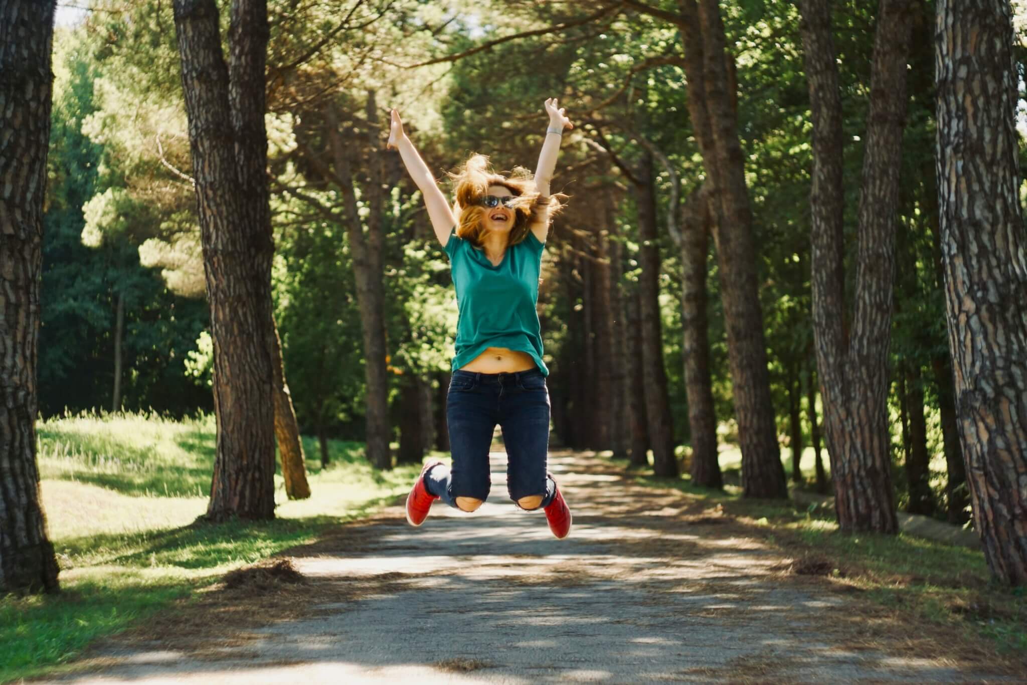 a woman jumping for joy