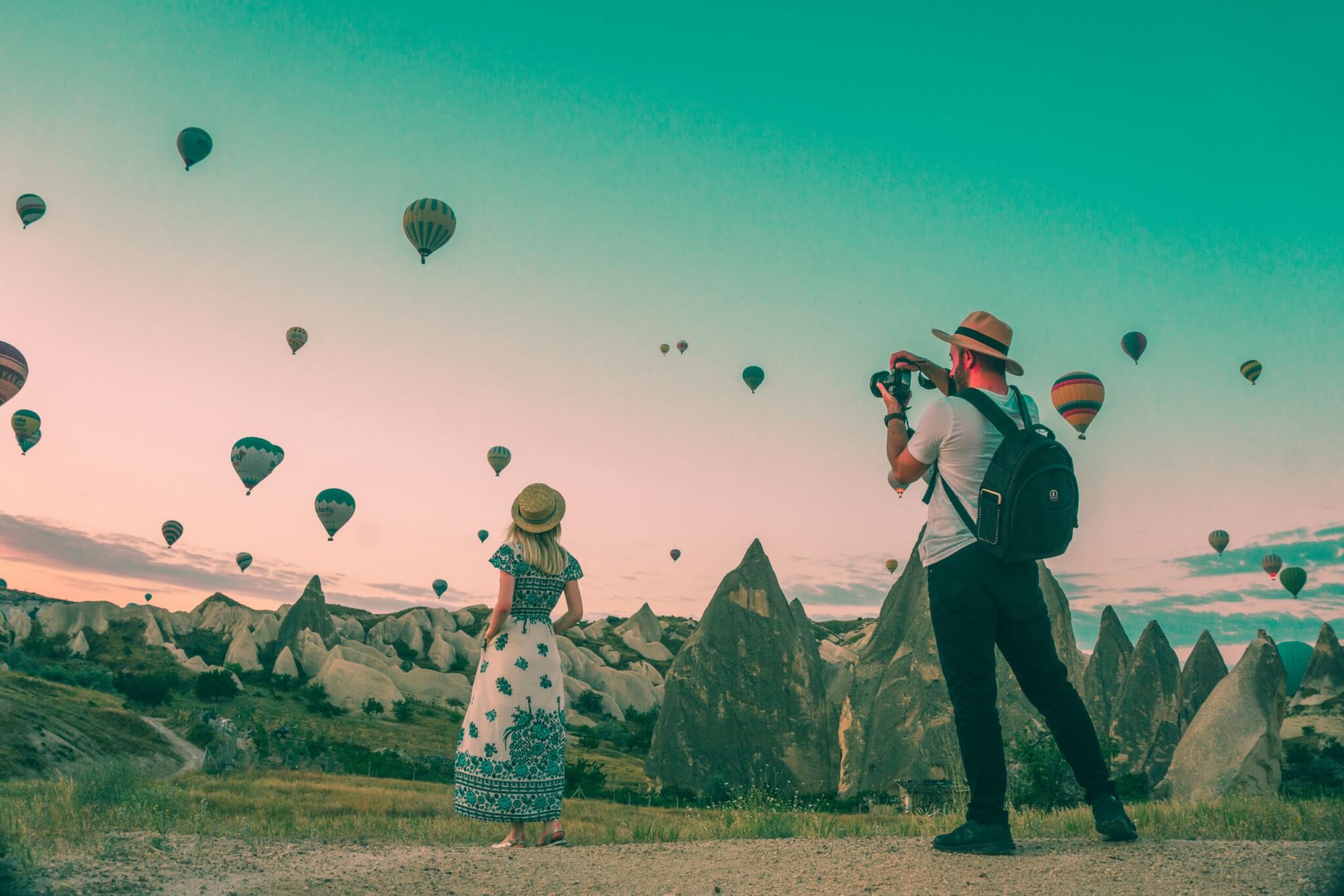 couple looking at hot air balloons