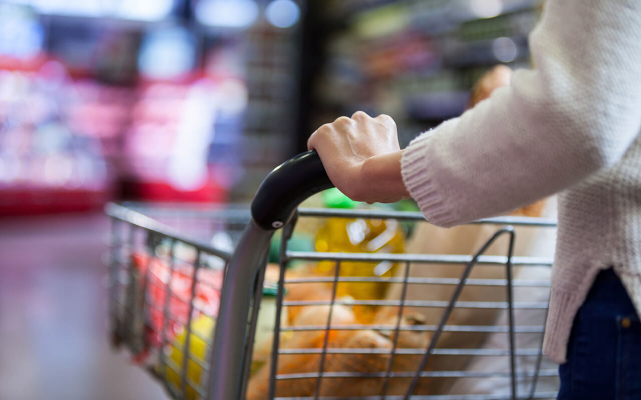 Woman pushing a grocery cart