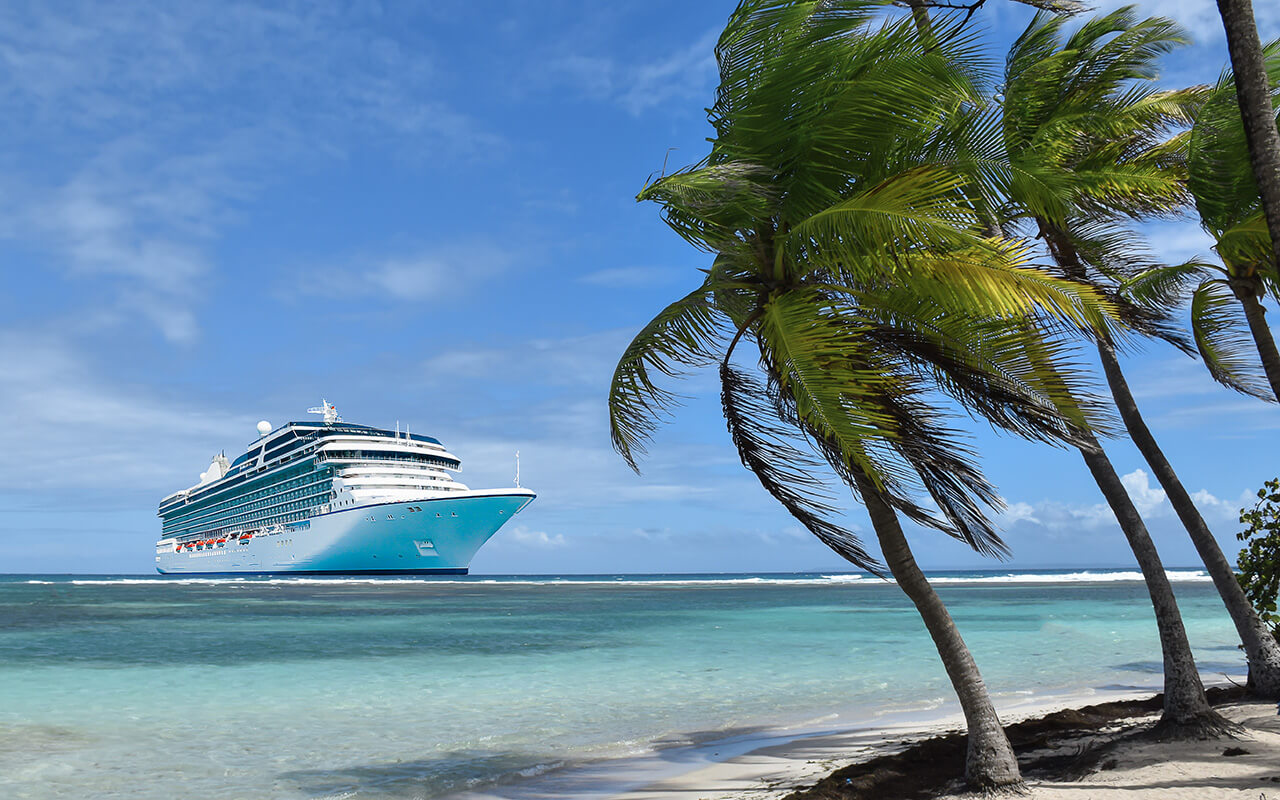 Cruise ship headed towards an island