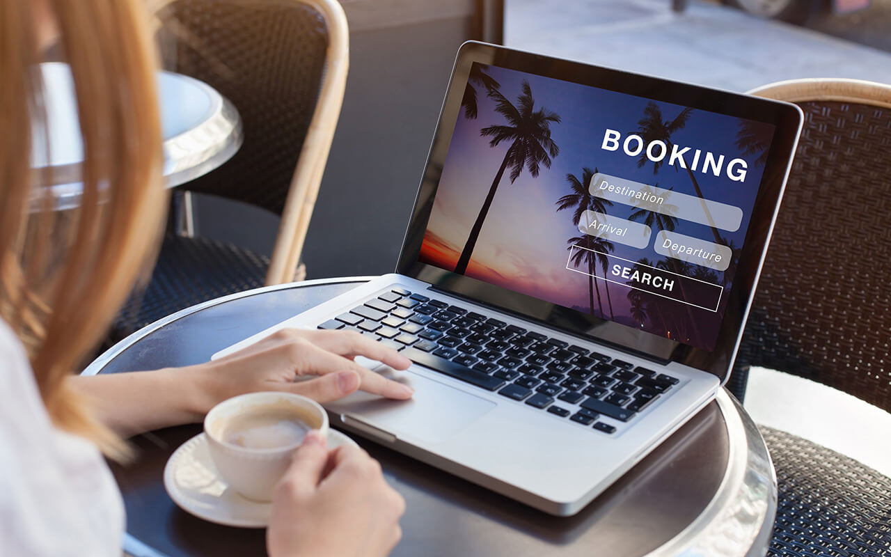 Booking a hotel room on a laptop