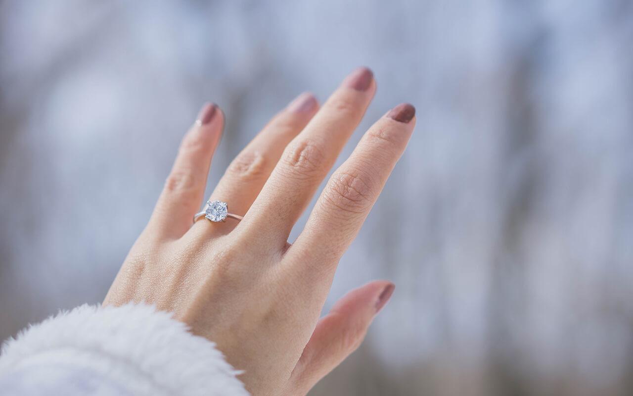 Woman with an engagement ring on her ring finger