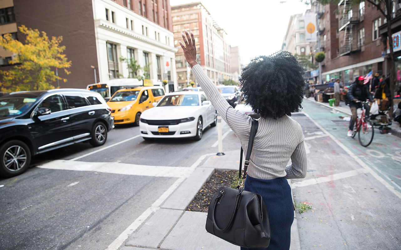 Woman hailing a cab