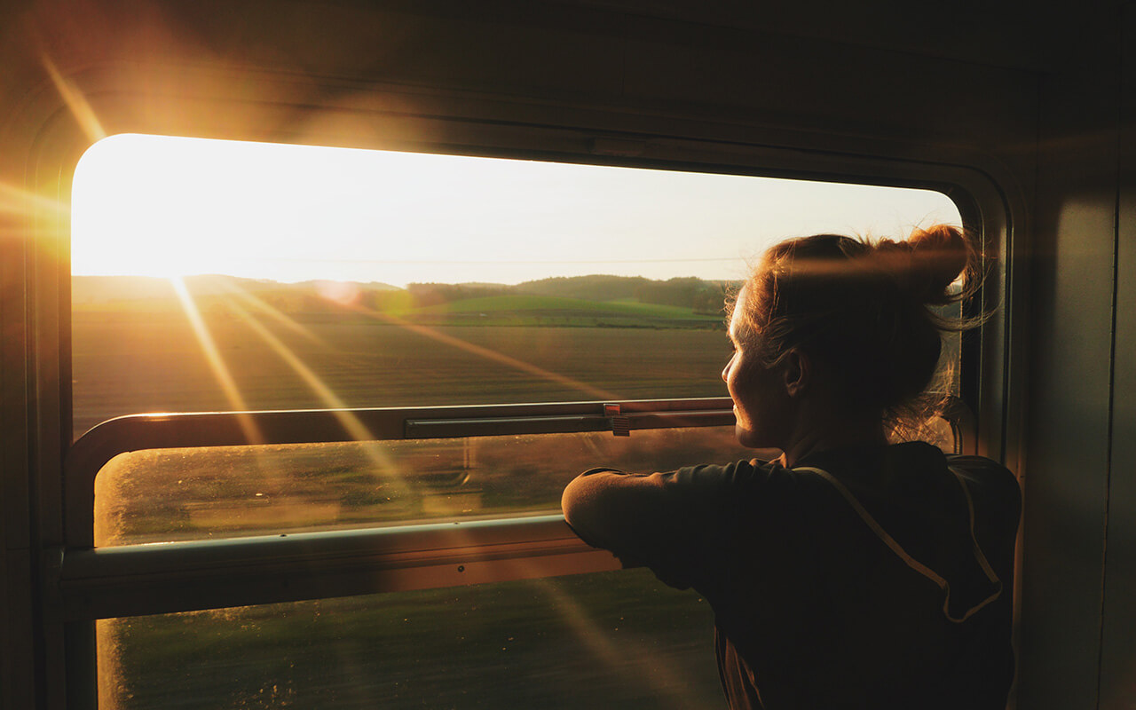 Woman looking out of train window